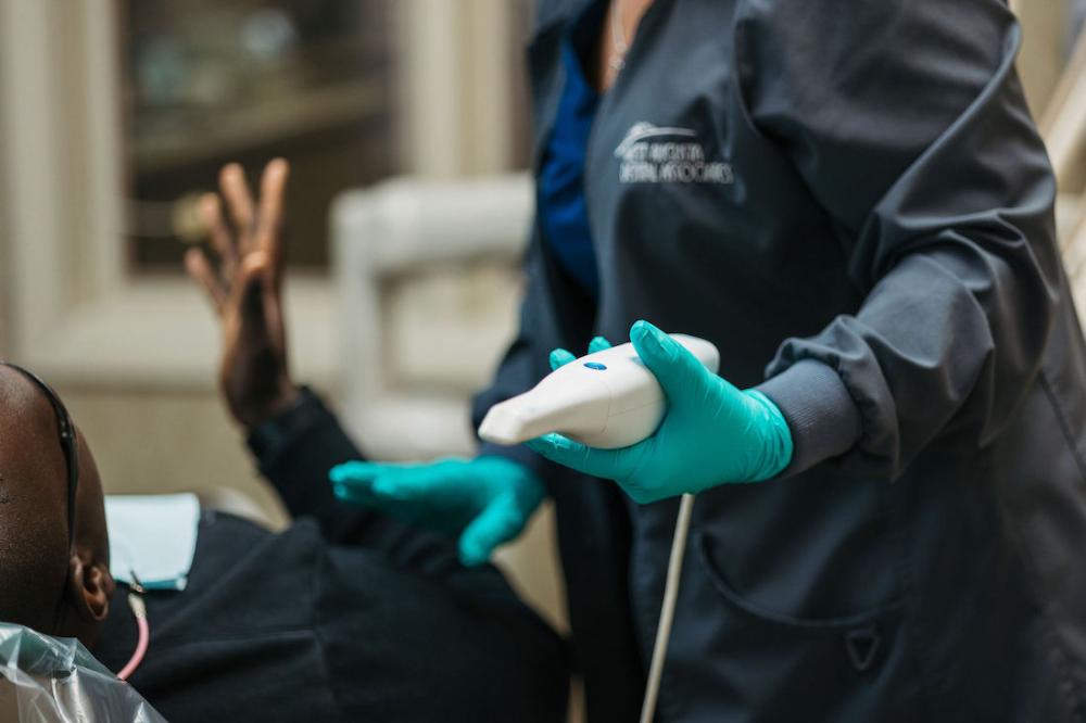 patient during dental consultation for tooth replacement in augusta