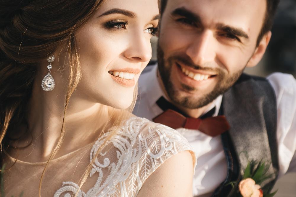 Confident couple smiling after full mouth reconstruction in Augusta GA