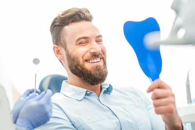 patient after restorative dentistry treatment with crowns and bridges in augusta