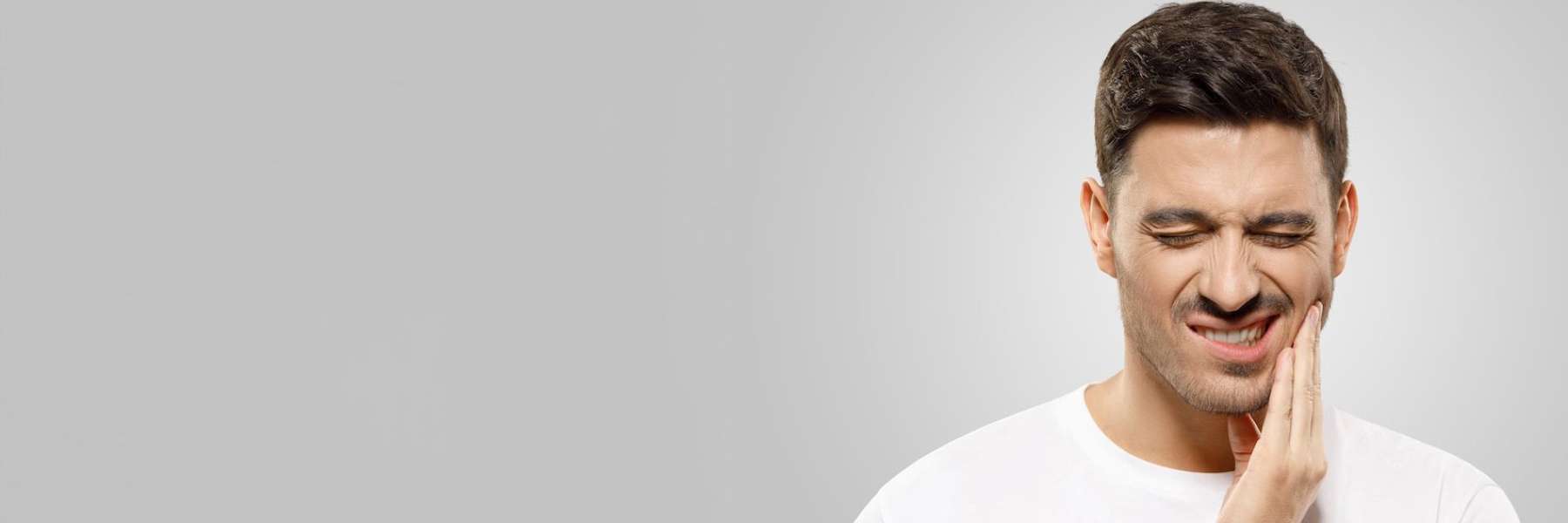 Patient in Augusta GA checking for signs of dental emergency like tooth pain or swelling