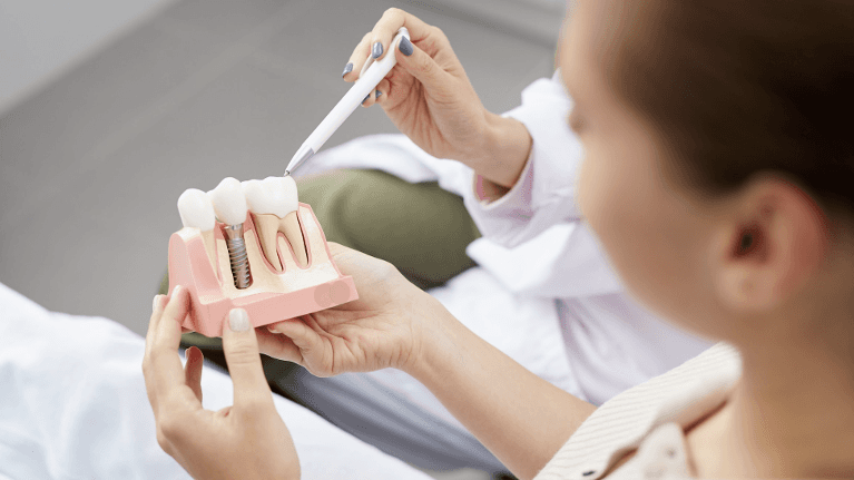 patient looking at dental implants in augusta, ga